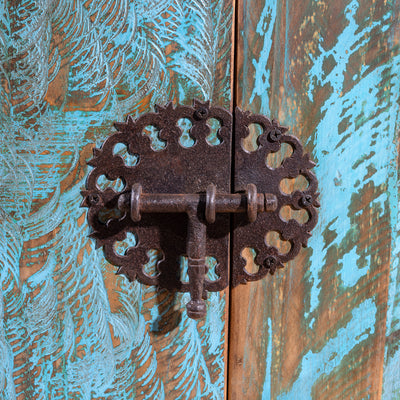 Ornate forged-iron latch on turquoise patina doors of Canyoncrest Patina Buffet