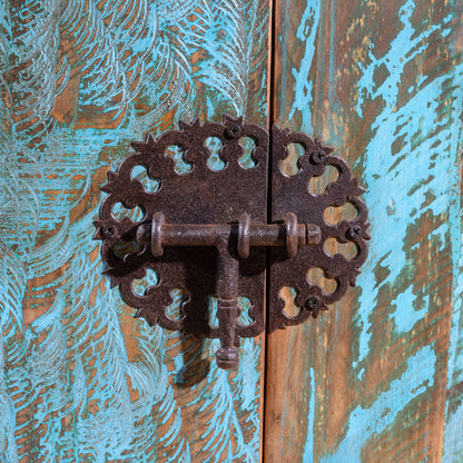 Ornate forged-iron latch on turquoise patina doors of Canyoncrest Patina Buffet