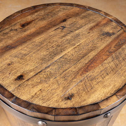 Round reclaimed wood top detail on rustic Western barrel accent table