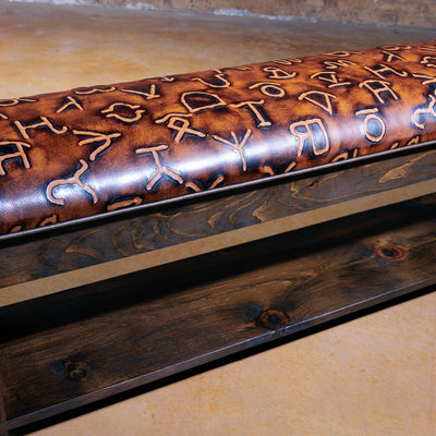 Custom handcrafted leather bench with ranch-style brand embossing