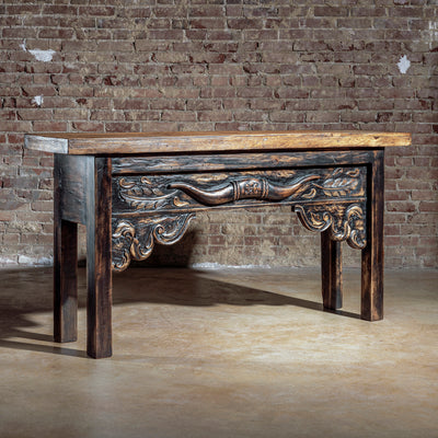 Hand-carved rustic Western console table with longhorn detail and artisan wood finish – angled view.