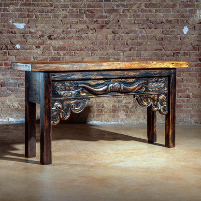 Hand-carved rustic Western console table with longhorn detail and artisan wood finish – angled view.