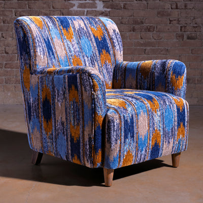 Cerulean Chimayo accent chair with blue patterned upholstery and wood legs