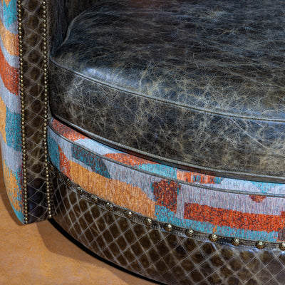 Close-up of quilted leather seat and vibrant fabric trim