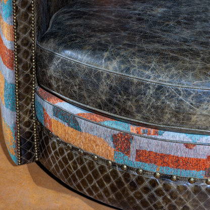 Close-up of quilted leather seat and vibrant fabric trim