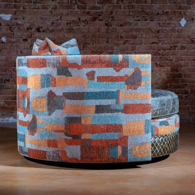 Side profile of extra-large swivel chair with nailhead accents