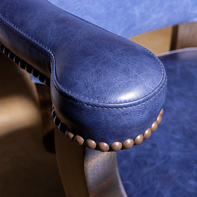 Cobalt Mesa Bar Stool western bar stool arm detail with padded top-grain leather armrest and bronze nailheads.