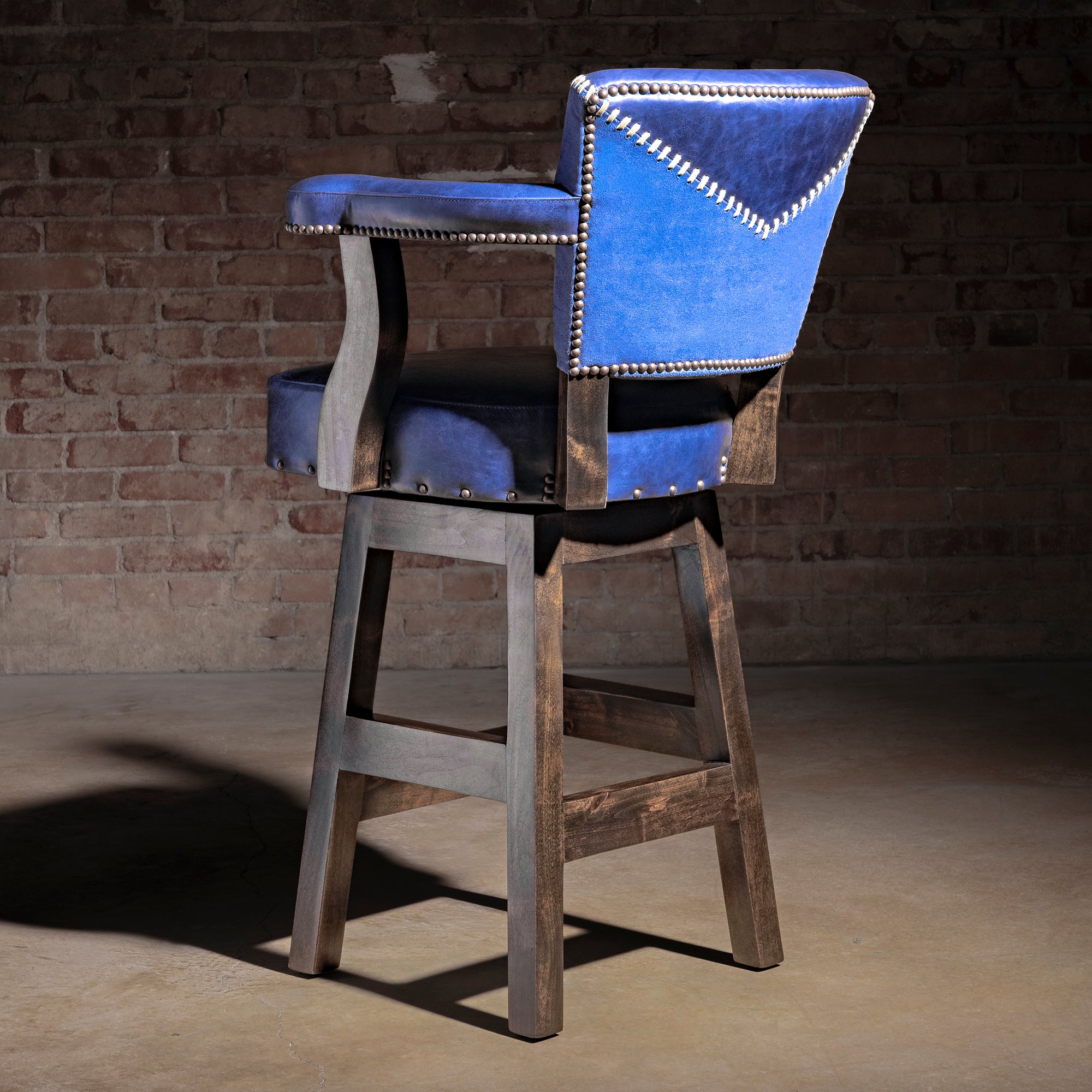 Cobalt Mesa Bar Stool western bar stool back view with cobalt leather, contrast suede yoke panel, and nailhead trim.