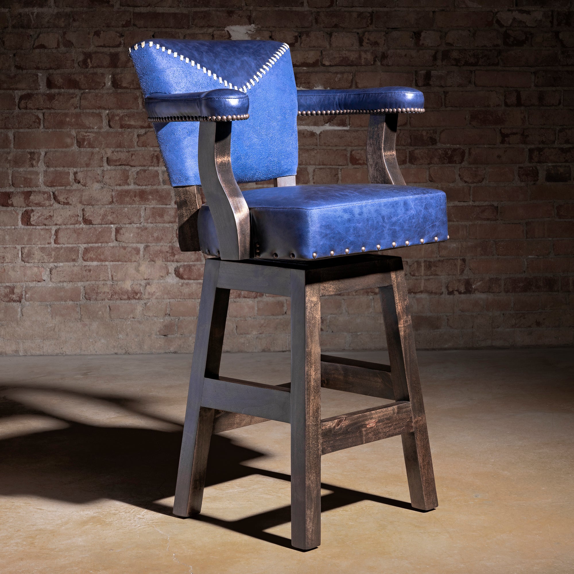 Cobalt Mesa Bar Stool western bar stool with top-grain blue leather, suede back panel, whipstitch detail, and wood base.