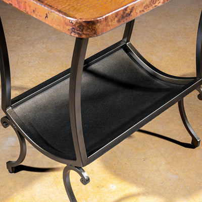 Cobre Scroll Table western accent table with hammered copper top, wrought iron frame, curved legs, and lower shelf