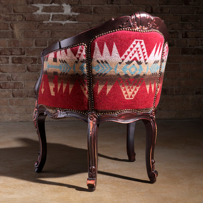 Back view of carved wood Western chair with bold Southwest pattern upholstery