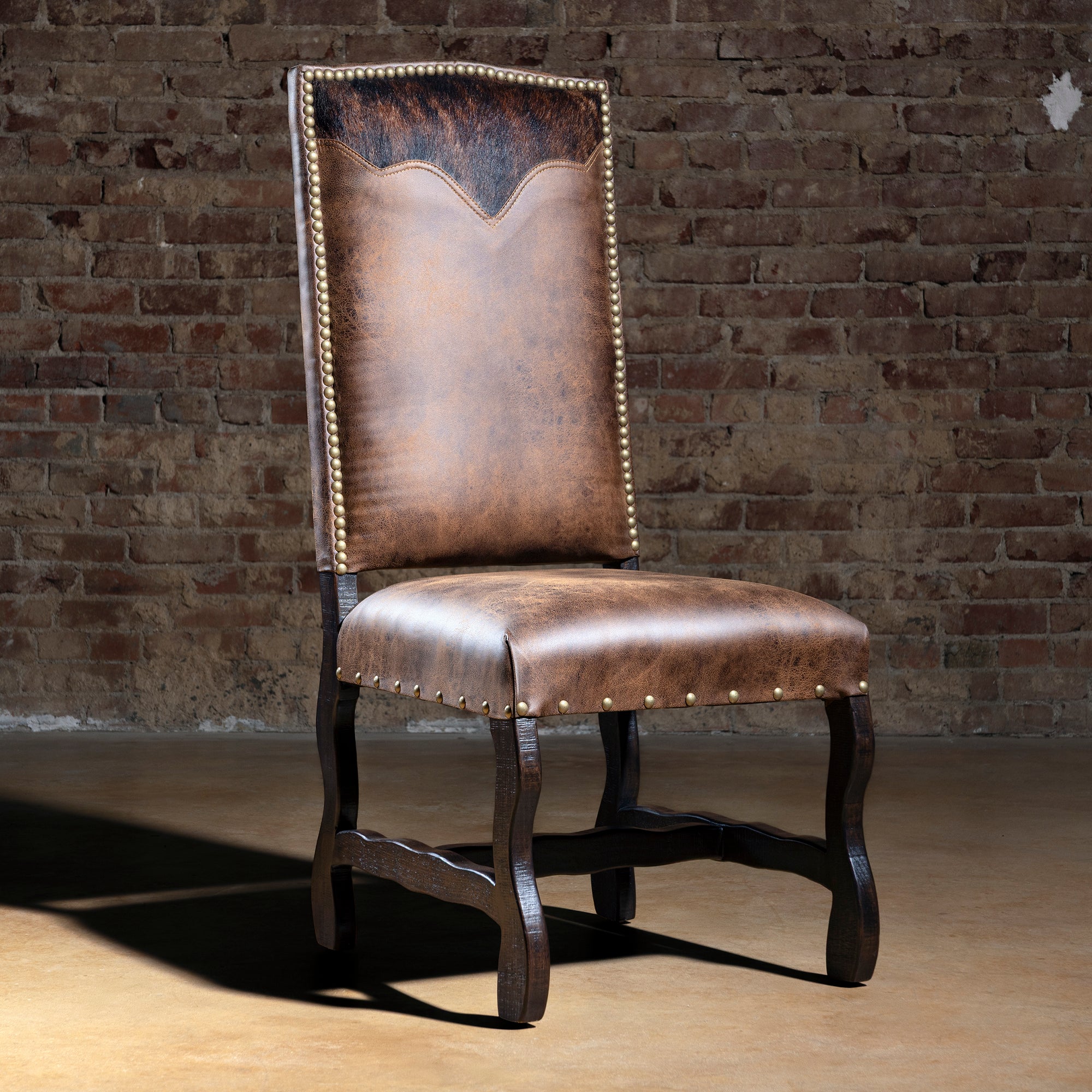 Comanche Yoke Dining Chair in distressed brown leather with cowhide yoke back and nailhead trim, Western dining chair for ranch homes and mountain lodge interiors