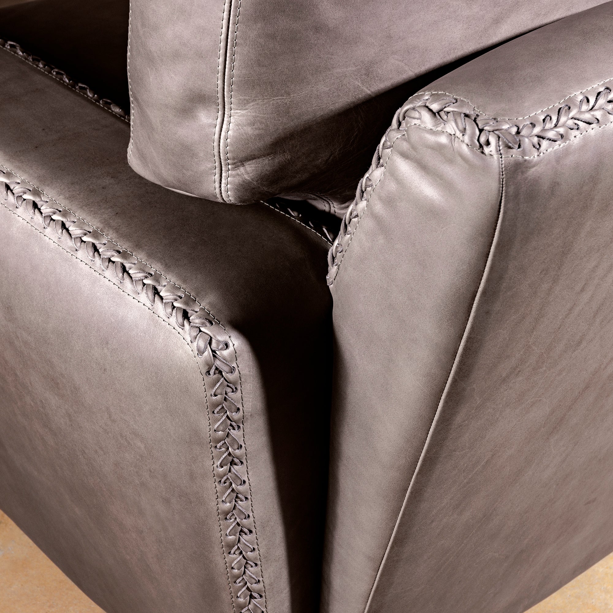 Close-up of whipstitch detail on Cortez Leather Chair
