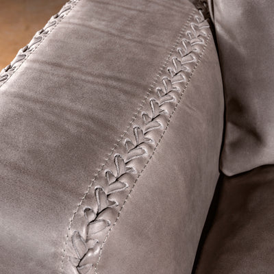 Close-up of whipstitch detail on the arm of the Cortez Leather Sofa
