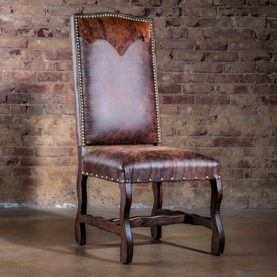 High-back Western dining chair in distressed brown microfiber with cowhide yoke and nailhead trim