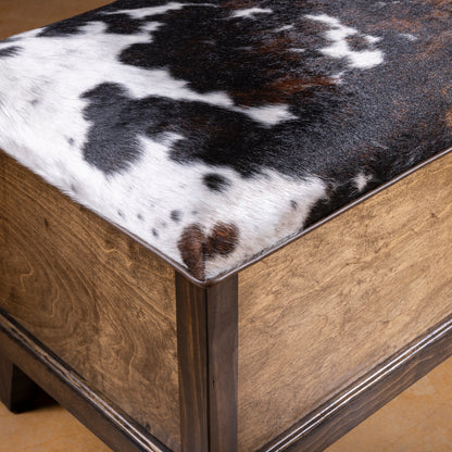 Close-up of genuine cowhide upholstery and hardwood frame detail