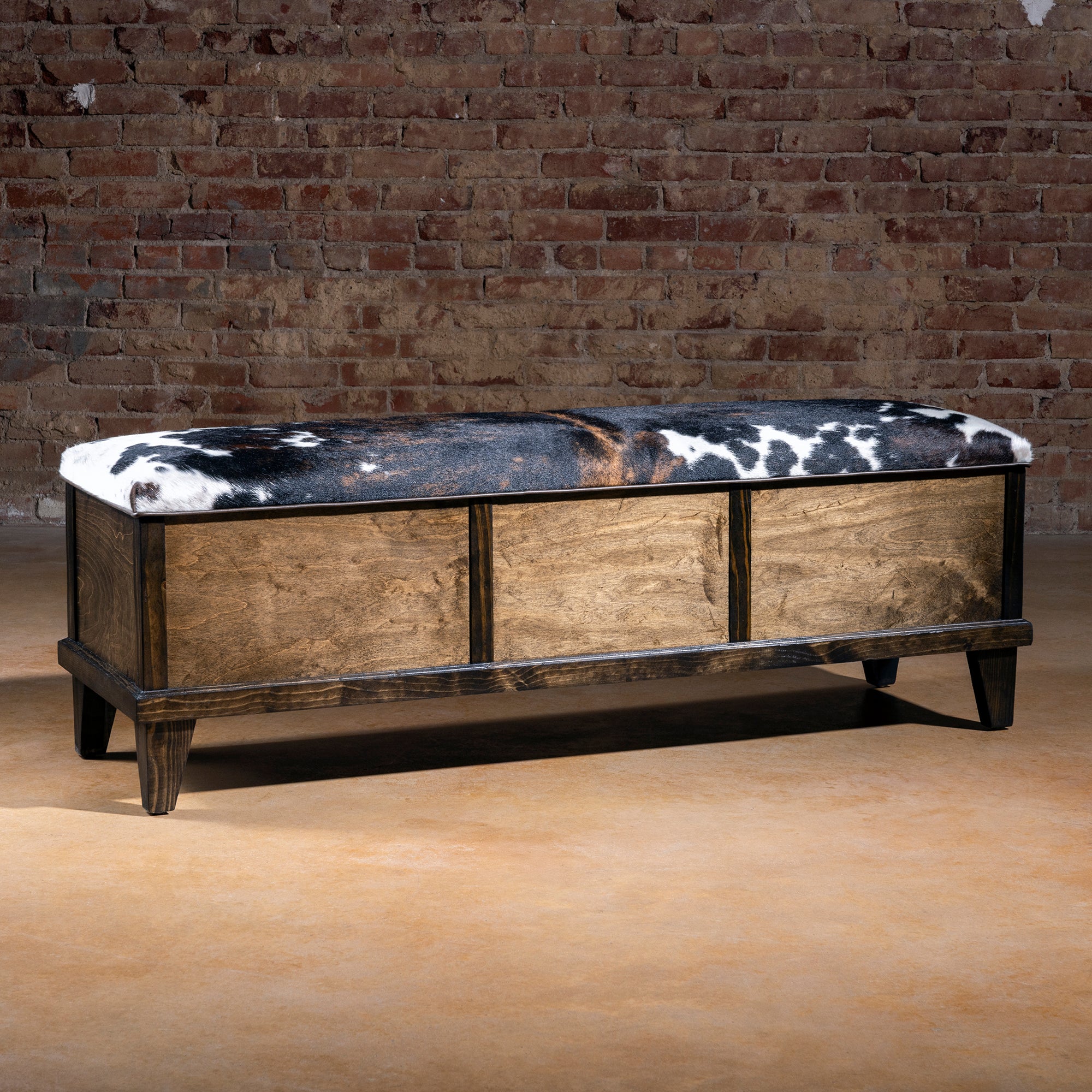 Cattleman’s Hide Storage Bench upholstered in natural Brazilian cowhide – front view