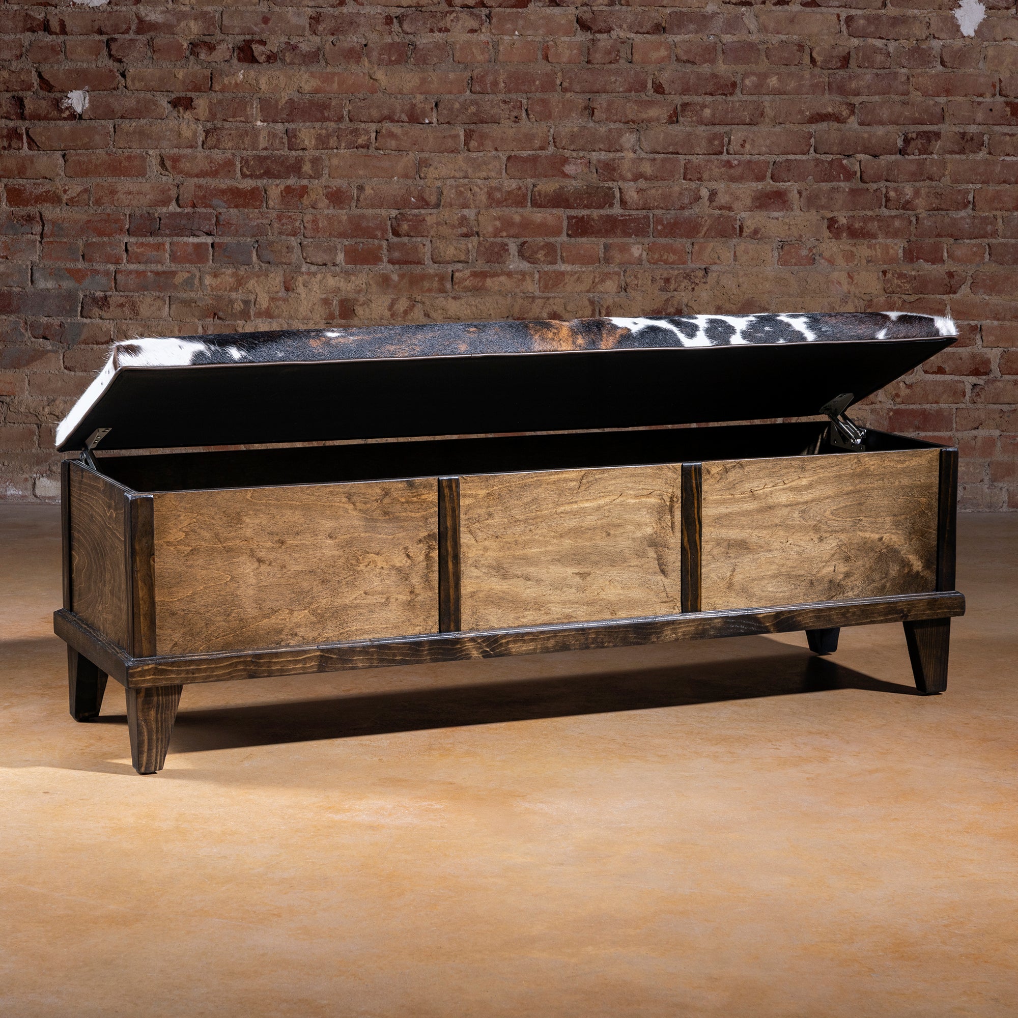 Open Cattleman’s Hide Storage Bench showing interior storage space