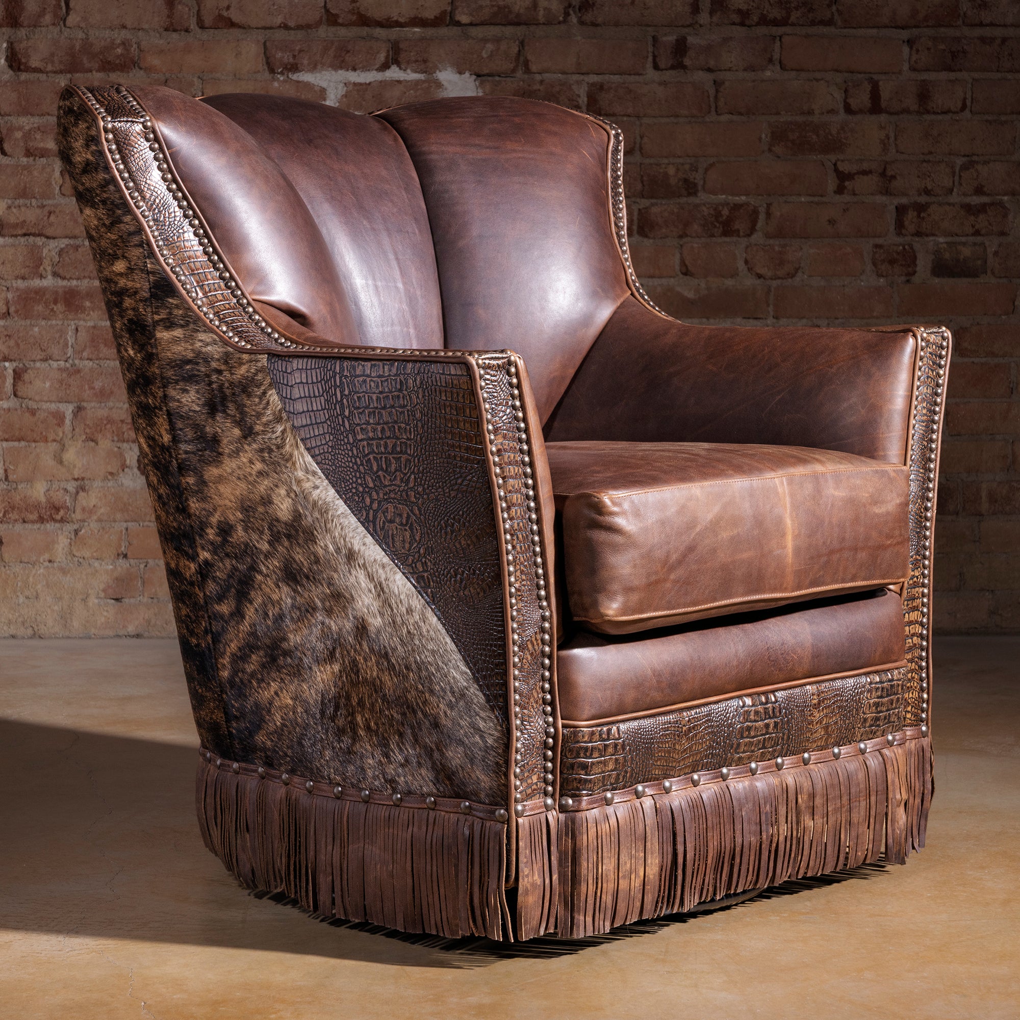Crestline brindle cowhide fringe swivel chair with croc-embossed leather trim