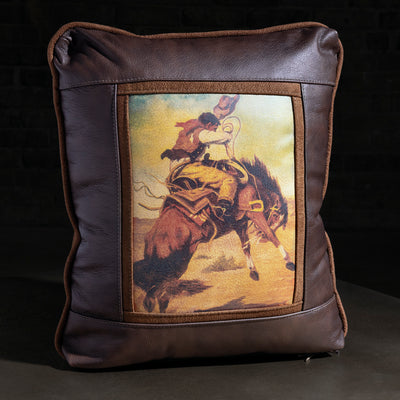 Dustline Bronco Rider Leather Western Throw Pillow western throw pillow with brown leather frame, bronc rider artwork, and suede trim
