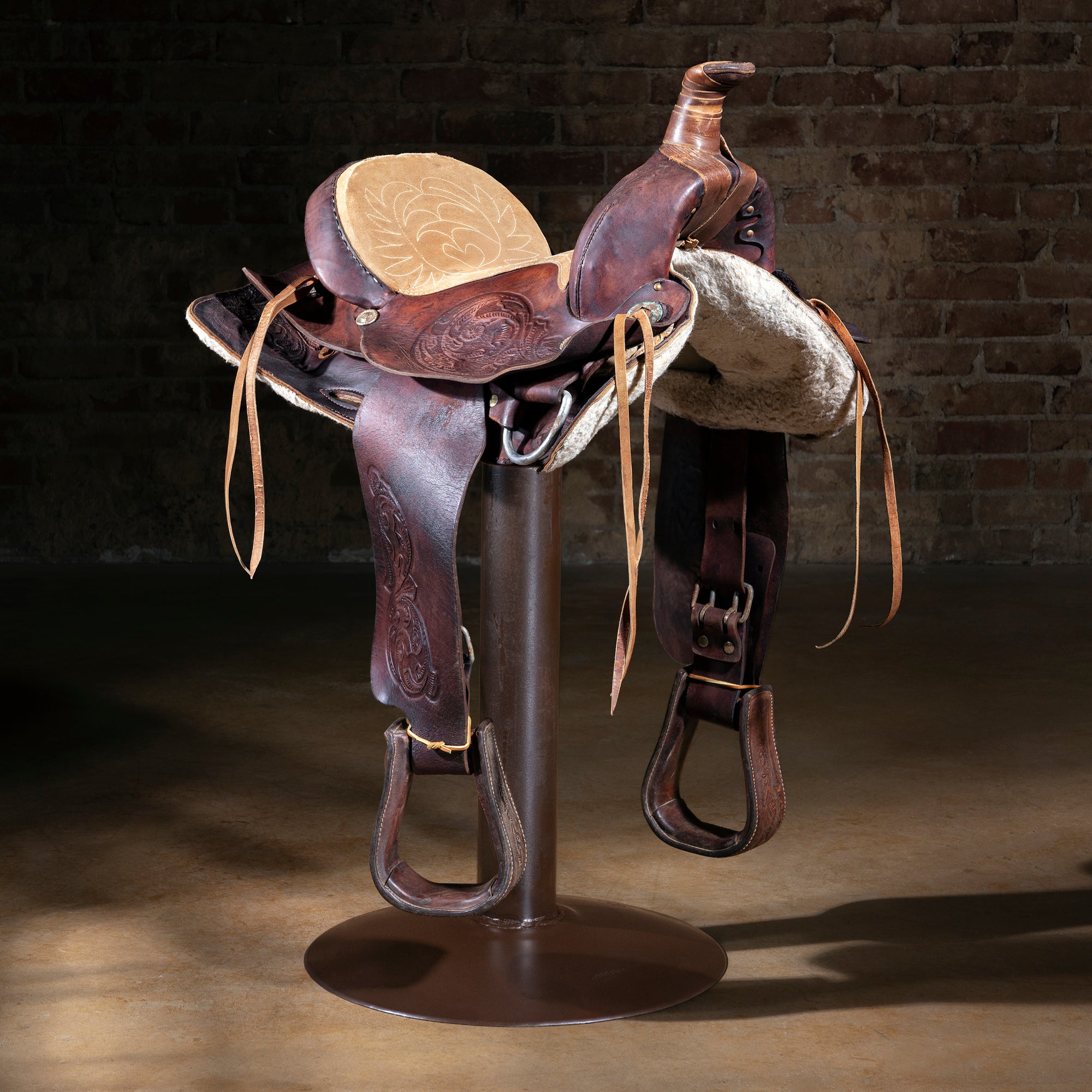 Dusty Creek Western saddle bar stool with aged leather saddle and iron 