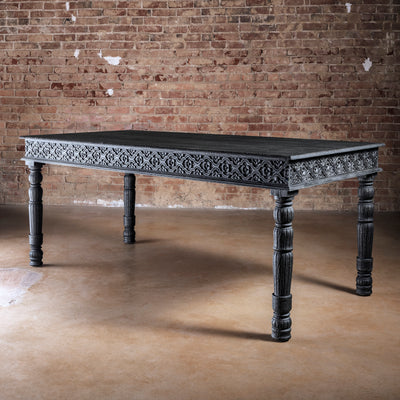 Fortville Carved Dining Table western hand carved dining table in black mango wood with ornate apron carving and turned legs