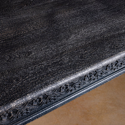 Fortville Carved Dining Table western hand carved dining table top detail with dark mango wood grain and softly worn heirloom finish
