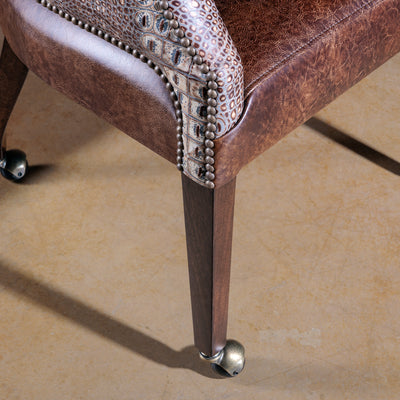 The Gambler’s Mark Western Poker Chair in embossed top-grain croc leather leg detail