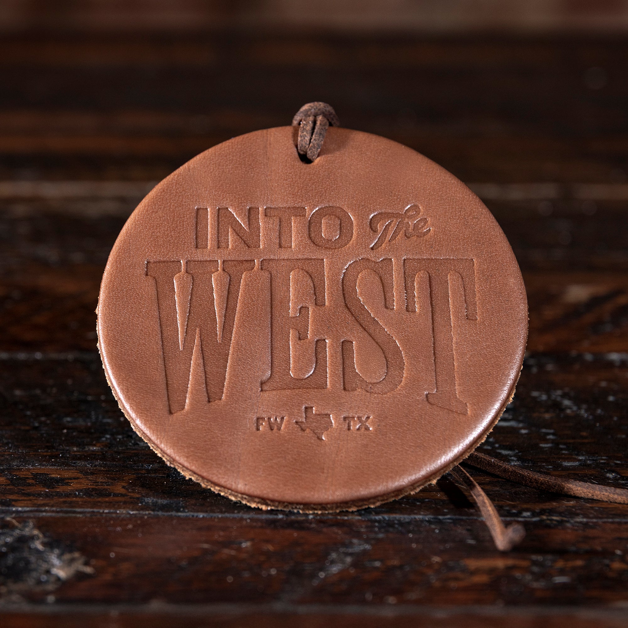 Embossed Into The West logo leather air freshener — handcrafted Western stocking stuffer gift.