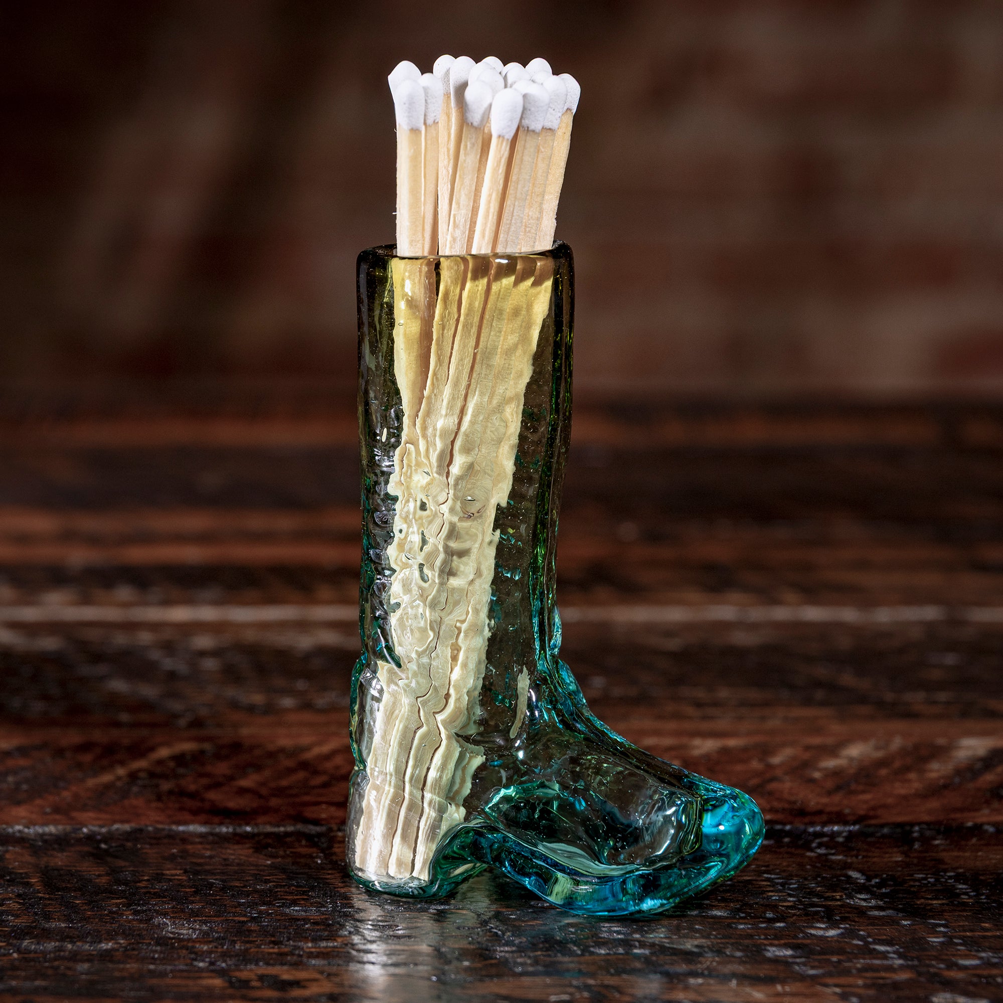 Handcrafted glass cowboy boot match holder from Into The West — Western home accent and stocking stuffer gift under $100.