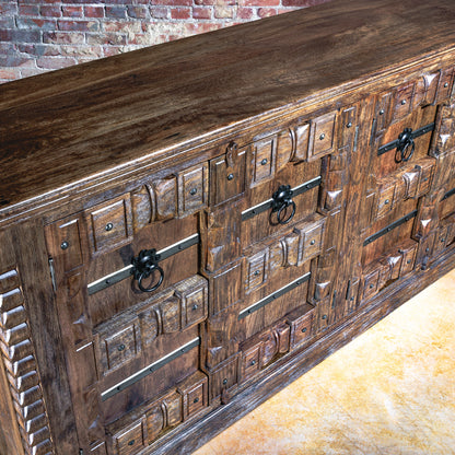 Angled view of large Western buffet with hand-carved drawers