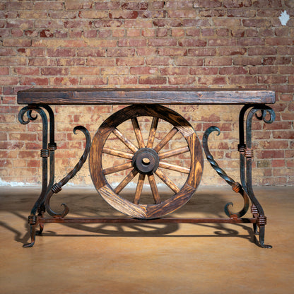 Hero image of rustic Western console table with wagon wheel and iron legs