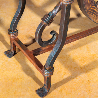 Detail of forged iron leg with scroll design