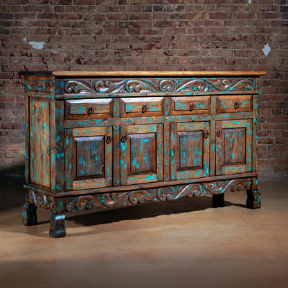 Angled view of Western buffet with turquoise distressed finish