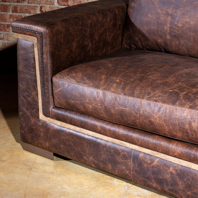 Handcrafted Western-style sectional sofa in full-grain leather with rustic texture and deep seating