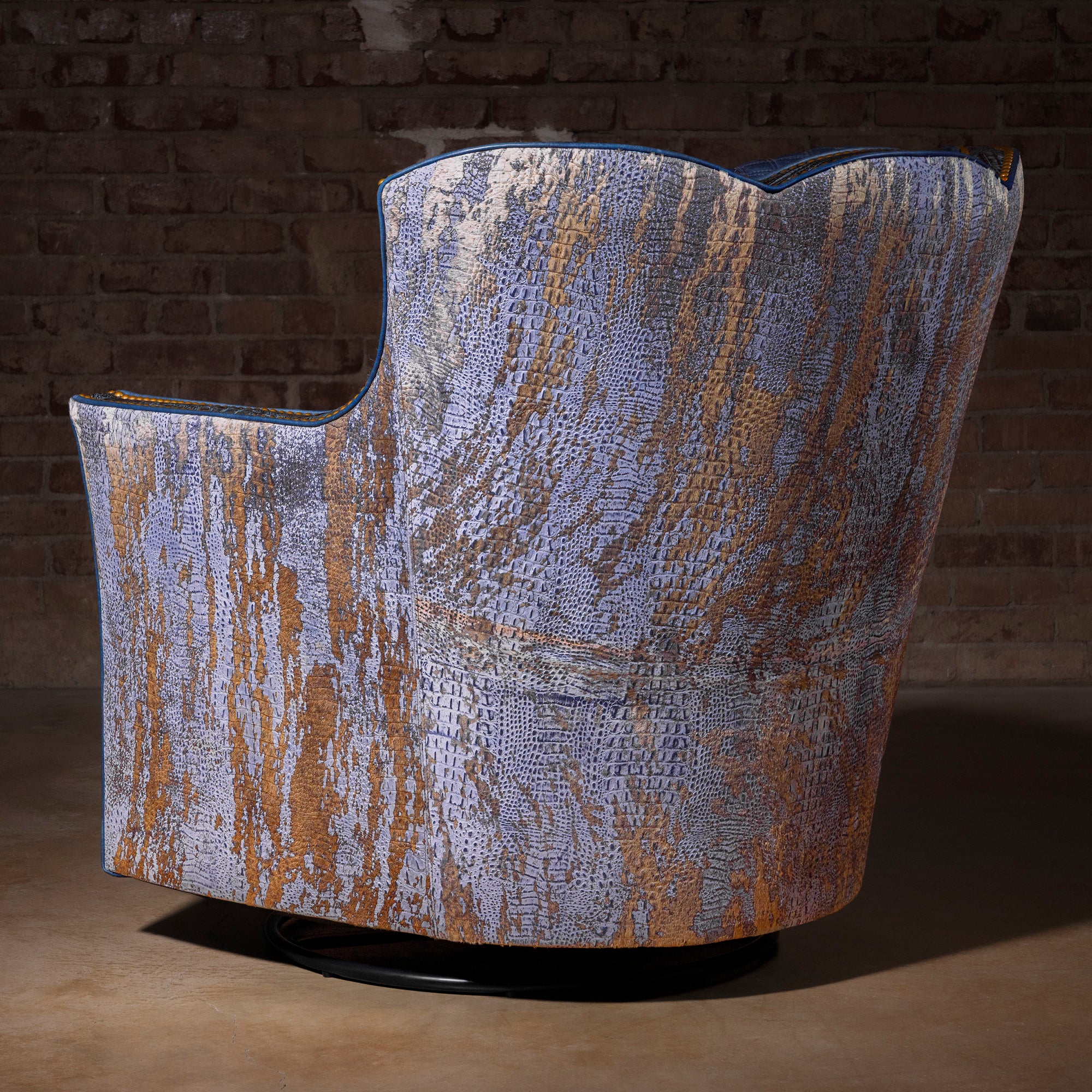 Acid-washed Brazilian cowhide back on Indigo Canyon Croc Swivel Chair