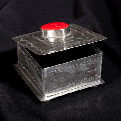 Open J. Alexander German silver box with velvet-lined interior and coral heart centerpiece