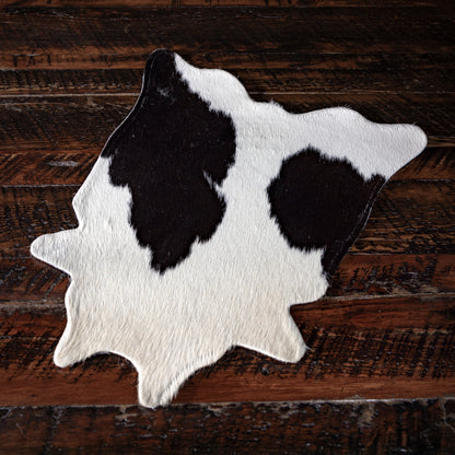 Genuine cowhide placemat from Into The West — handcrafted Western table décor and gift under $100.