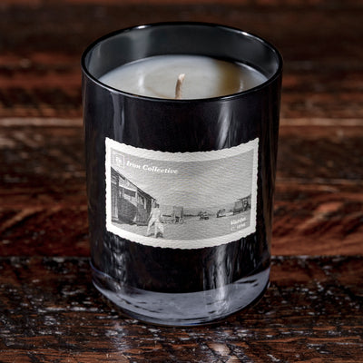 Tranquilo candle by Iron Collective — blend of vanilla, smoke, and bergamot in black glass vessel.
