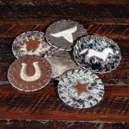 Western-style cowhide coaster set — rustic ranch home décor and barware.