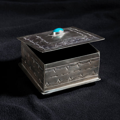 Open Santa Fe Turquoise Sunburst Box by J. Alexander showing velvet-lined interior and hand-tooled lid