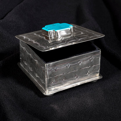 Open J. Alexander turquoise cross heirloom box showing velvet-lined interior and hand-tooled silver craftsmanship