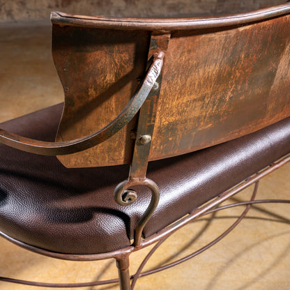 Aged patina backrest detail on Ironwind Ranch Settee forged-iron bench