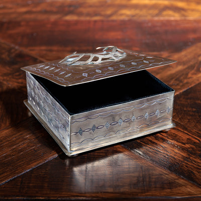 Velvet-lined interior of silver antler trinket box