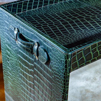 Close-up of stitched leather handle on crocodile bar cart