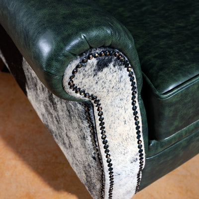 Close-up of leather armrest with nailhead accents and premium cowhide panel – Cattleman’s Retreat chair