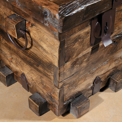 Base detail showing block feet on small Western reclaimed wood trunk table