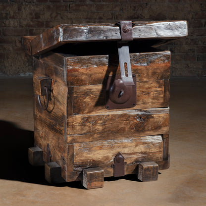 Small reclaimed wood trunk accent table with iron strap hinges and latch hardware