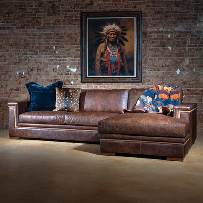 Western leather sectional sofa with chaise in top-grain saddle brown, featuring clean lines and suede trim