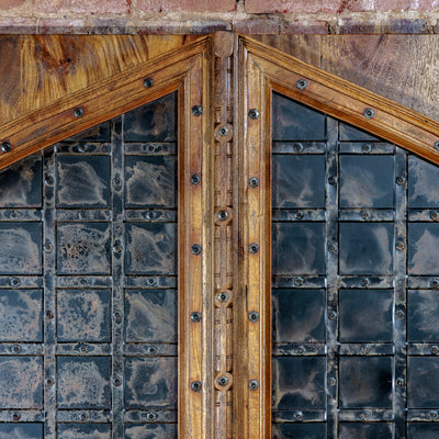 Detail of hand-forged iron and mango wood headboard